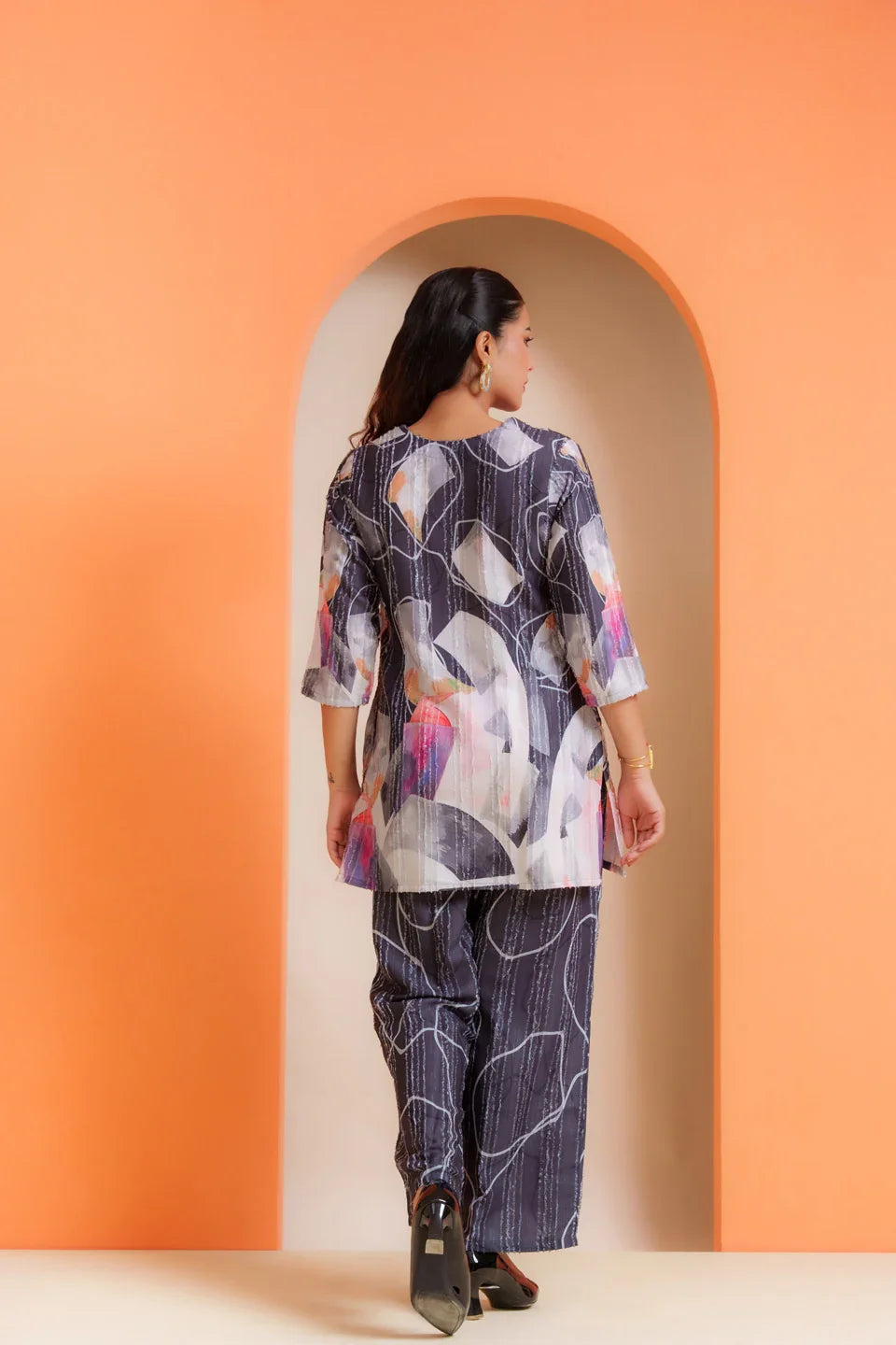 Woman in abstract print co-ord set, pure viscose fabric, stylish for parties & everyday wear
