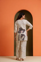 Woman in printed viscose co-ord set with graphic back design, stylish for parties and everyday wear