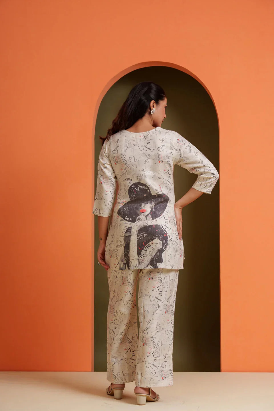 Woman in printed viscose co-ord set with graphic back design, stylish for parties and everyday wear
