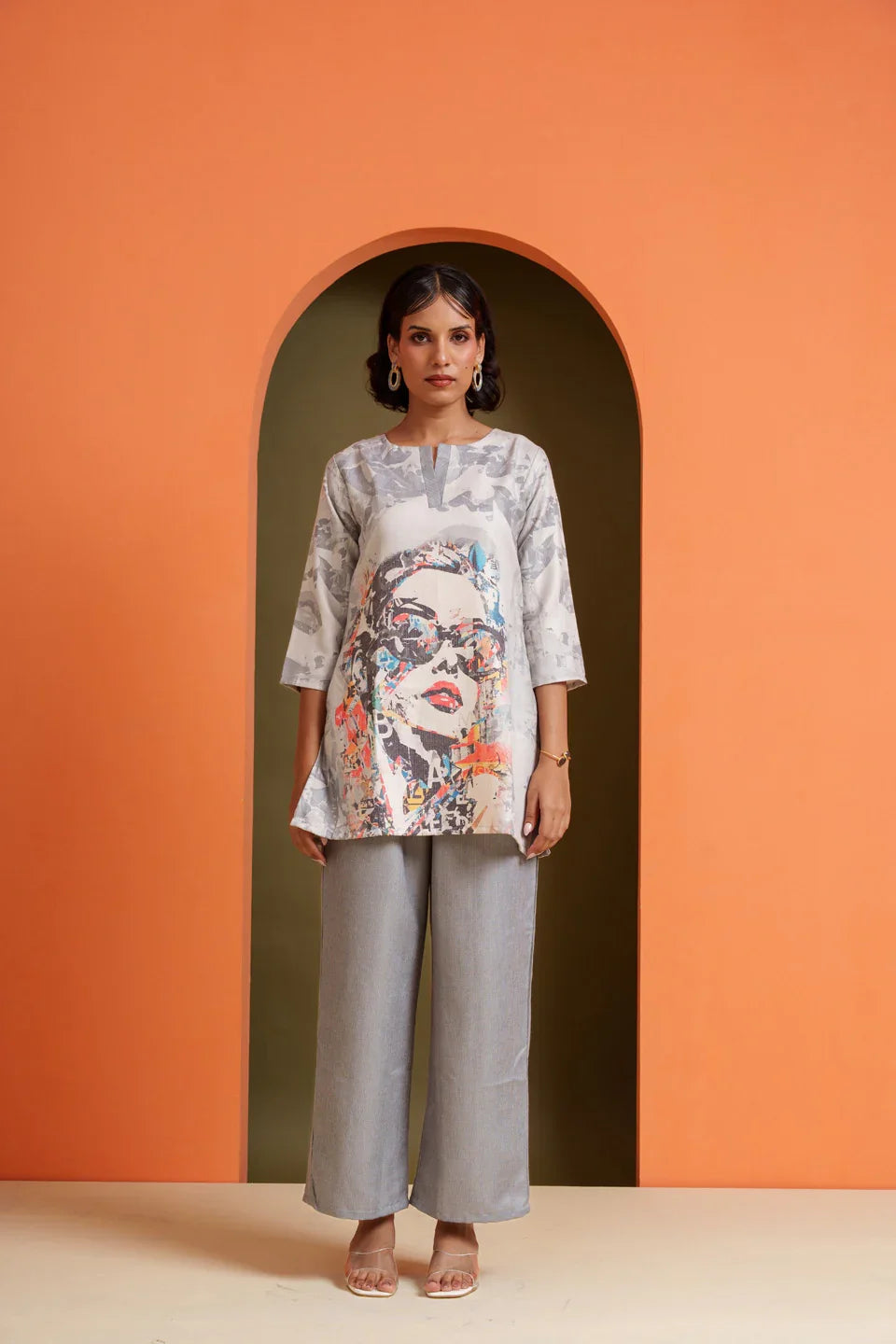 Woman in artistic print tunic and grey palazzo pants, stylish co-ord set for casual or festive wear